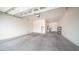 Spacious garage area with an electric car charger and storage at 4323 E Wheaton St, Gilbert, AZ 85295