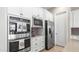 Bright kitchen features stainless steel appliances, white cabinetry, and modern finishes for a stylish cooking space at 4323 E Wheaton St, Gilbert, AZ 85295