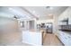 Bright and spacious kitchen with stainless steel appliances, white cabinets, and large island, perfect for cooking and entertaining at 4323 E Wheaton St, Gilbert, AZ 85295