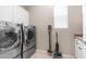 Laundry room featuring new washer and dryer appliances, as well as countertop and storage at 4323 E Wheaton St, Gilbert, AZ 85295