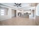Bright and airy living space with open floor plan, tiled flooring, and abundant natural light, ideal for modern living at 4323 E Wheaton St, Gilbert, AZ 85295