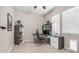 Functional home office featuring a built-in desk, shelving, and natural light, ideal for productivity and organization at 4323 E Wheaton St, Gilbert, AZ 85295