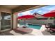 Pool with waterfall feature and lounge seating at 4323 E Wheaton St, Gilbert, AZ 85295