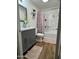 Updated bathroom featuring a stylish vanity, decorative mirror, shower, and modern finishes at 4902 W Vista Ave, Glendale, AZ 85301