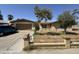 Charming single-story home featuring a well-maintained front yard, complemented by a lovely fence and mature tree at 4902 W Vista Ave, Glendale, AZ 85301
