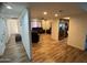 Open floorplan featuring wood floors, living room and kitchen at 4902 W Vista Ave, Glendale, AZ 85301