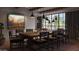 Elegant dining room featuring a rustic wooden table, stylish chairs, and modern pendant lighting with backyard pool view at 4915 N Ascent Dr, Scottsdale, AZ 85251