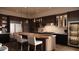 Modern kitchen featuring stainless steel appliances, a wood breakfast bar, and dark cabinetry at 4915 N Ascent Dr, Scottsdale, AZ 85251