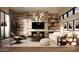 Bright and airy living room with a fireplace, modern furniture, and hardwood floors at 4915 N Ascent Dr, Scottsdale, AZ 85251