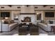 Cozy living room with a fireplace, comfortable seating, and stylish decorative elements at 4915 N Ascent Dr, Scottsdale, AZ 85251