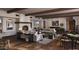 Spacious living room with a fireplace, beamed ceilings, and cozy seating arrangements at 4915 N Ascent Dr, Scottsdale, AZ 85251