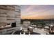 Relaxing outdoor patio with a fireplace, comfortable seating, and a scenic view at 4915 N Ascent Dr, Scottsdale, AZ 85251