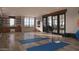 Bright studio with yoga mats, fitness equipment, and natural light filtering through windows into the workout space at 4915 N Ascent Dr, Scottsdale, AZ 85251