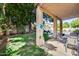 Covered patio overlooks a lush backyard with a sparkling swimming pool at 514 E Yvonne Ln, Tempe, AZ 85284