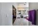 Modern bathroom with dual vanities, white cabinetry, a full mirror, and access to the closet at 514 E Yvonne Ln, Tempe, AZ 85284