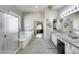 Bathroom with large shower and soaking tub, next to large double vanity with granite counters at 514 E Yvonne Ln, Tempe, AZ 85284