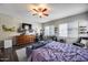 Cozy bedroom featuring an entertainment center, desk, seating area, and abundant natural light at 514 E Yvonne Ln, Tempe, AZ 85284