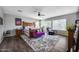 Primary bedroom features ceiling fan, seating area, and large windows that allow ample natural light at 514 E Yvonne Ln, Tempe, AZ 85284