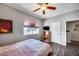 Bedroom features a ceiling fan, nice window, and wood-look floors at 514 E Yvonne Ln, Tempe, AZ 85284