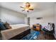 Bedroom features a ceiling fan, wood-look flooring, and neutral tones at 514 E Yvonne Ln, Tempe, AZ 85284