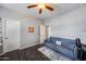 Flex room with a neutral colored sofa, wood-look floor, and bright lighting at 514 E Yvonne Ln, Tempe, AZ 85284