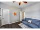 Flex room with a neutral colored sofa, wood-look floor, and bright lighting at 514 E Yvonne Ln, Tempe, AZ 85284