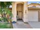 Inviting front entrance with arched doorway, desert landscaping, and stone walkway at 514 E Yvonne Ln, Tempe, AZ 85284