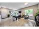Spacious game room filled with natural light, complemented by a pool table and seating area at 514 E Yvonne Ln, Tempe, AZ 85284