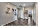 Hallway features wood floors, white cabinets, and an assortment of framed photos on the walls at 514 E Yvonne Ln, Tempe, AZ 85284