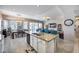 Modern kitchen with a large island, granite countertops, and open layout to dining and living areas at 514 E Yvonne Ln, Tempe, AZ 85284