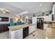 Bright, spacious kitchen with granite countertops, white cabinetry and black stainless steel appliances at 514 E Yvonne Ln, Tempe, AZ 85284