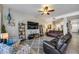 Comfortable living room featuring a ceiling fan and modern decor with easy access to other living areas at 514 E Yvonne Ln, Tempe, AZ 85284