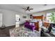 Spacious main bedroom featuring hardwood floors, wooden furniture, ceiling fan, and access to the bathroom at 514 E Yvonne Ln, Tempe, AZ 85284
