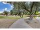 Scenic neighborhood park with walking paths, mature trees, and manicured landscaping at 514 E Yvonne Ln, Tempe, AZ 85284