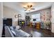 A cozy office with desk, couch, shelving, and lots of natural light at 514 E Yvonne Ln, Tempe, AZ 85284