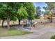 Community playground with slide, benches, and green trees, ideal for Gathering fun at 514 E Yvonne Ln, Tempe, AZ 85284