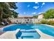 Inviting backyard pool and spa with a waterfall feature and beautiful landscaping for relaxation at 514 E Yvonne Ln, Tempe, AZ 85284