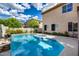 A pristine swimming pool and spa with a view of the house and back yard at 514 E Yvonne Ln, Tempe, AZ 85284