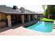 Backyard pool, patio, and covered area offers space for outdoor entertainment and relaxation at 6372 W Redfield Rd, Glendale, AZ 85306