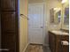 Bathroom featuring wooden cabinets, a vanity, toilet and tile floors at 650 N Hawes Rd # 4007, Mesa, AZ 85207
