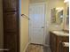 Bathroom featuring wooden cabinets, a vanity, toilet and tile floors at 650 N Hawes Rd # 4007, Mesa, AZ 85207