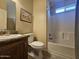 Bathroom with a vanity, toilet, and shower/tub combination at 650 N Hawes Rd # 4007, Mesa, AZ 85207