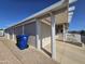 Exterior view of the home featuring a covered carport, porch, and well-maintained landscaping at 650 N Hawes Rd # 4007, Mesa, AZ 85207