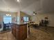 Bright, open-concept living area with kitchen island, dining, and comfortable lounge at 650 N Hawes Rd # 4007, Mesa, AZ 85207