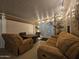 Enclosed patio with sofa, chairs, and decorative lighting at 650 N Hawes Rd # 4007, Mesa, AZ 85207