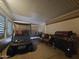 Enclosed patio with golf cart, grill, and seating area at 650 N Hawes Rd # 4007, Mesa, AZ 85207