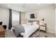Comfortable bedroom with a large bed, neutral decor, and bright lighting at 6957 E Osborn Rd # A, Scottsdale, AZ 85251