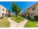 Beautifully maintained community grounds with lush lawns and mature trees at 6957 E Osborn Rd # A, Scottsdale, AZ 85251