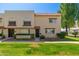 Charming townhome showcasing a well-manicured lawn and brick facade at 6957 E Osborn Rd # A, Scottsdale, AZ 85251