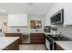 Spacious kitchen with stainless steel dishwasher, range, and white countertops at 6957 E Osborn Rd # A, Scottsdale, AZ 85251